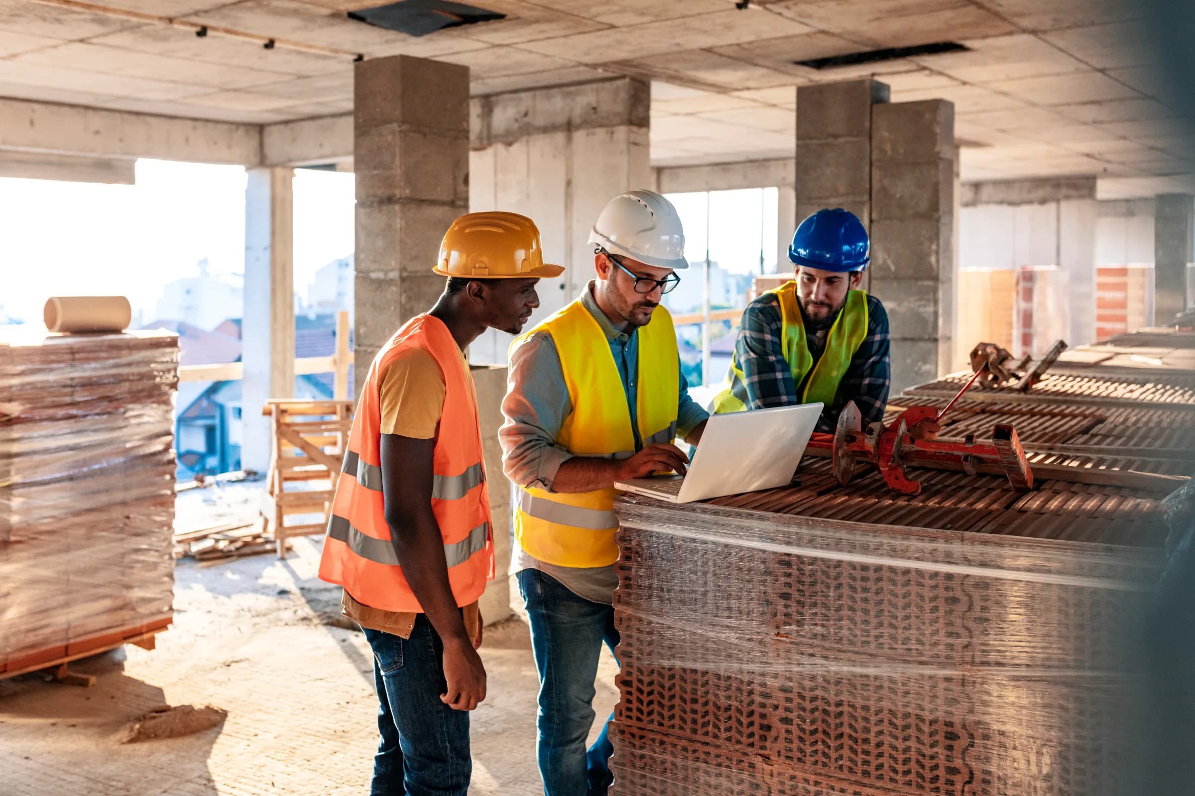 Construction superintendent reviewing blueprints on a jobsite