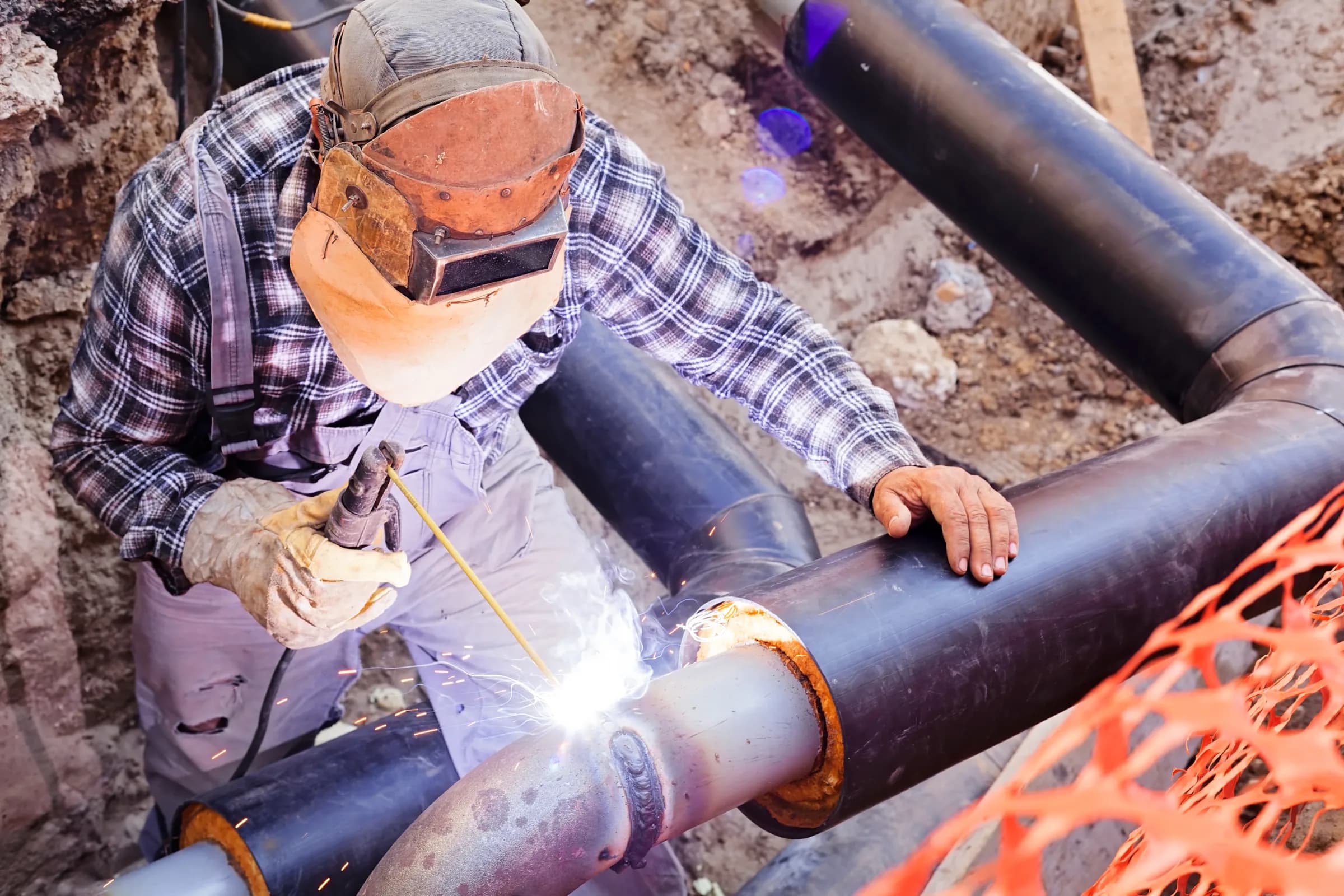 Welder performing precision 6G weld on industrial piping